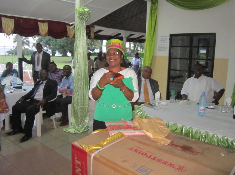 Mme Pauline Welang expressing happiness with a gift